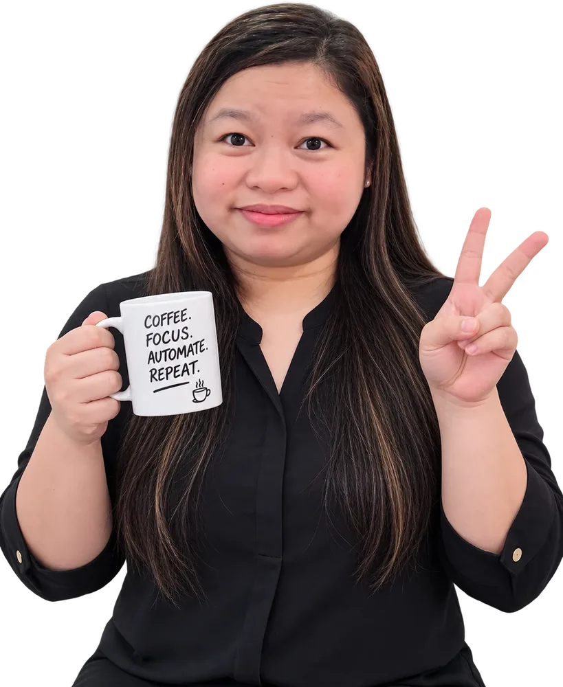 Lucia giving a peace sign and holding a 'Coffee. Focus. Automate. Repeat.' mug
